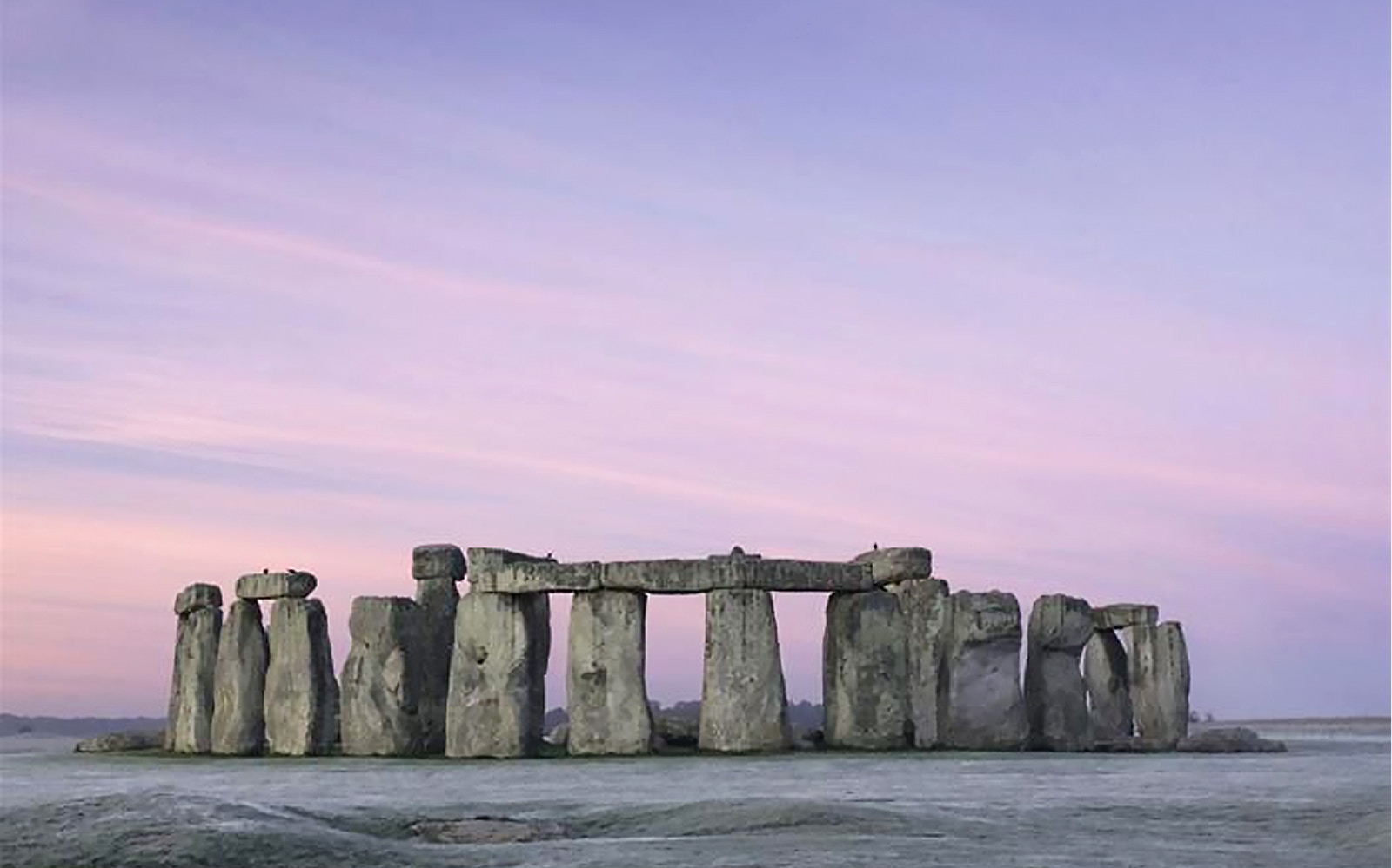 Stonehenge at dawn during Boxing Day tour, Wiltshire, England.