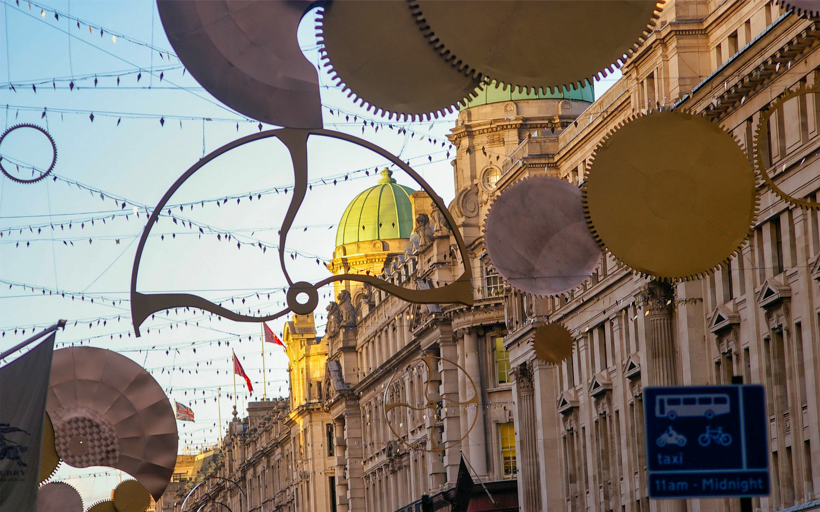 London street decorated with festive lights and ornaments on Christmas Day.