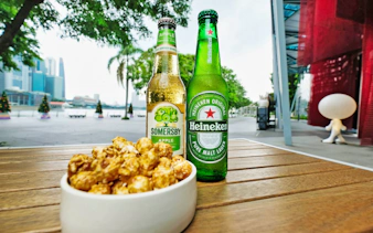 Bottles of cider and beer with caramel popcorn at Red Dot Design Museum, Singapore.