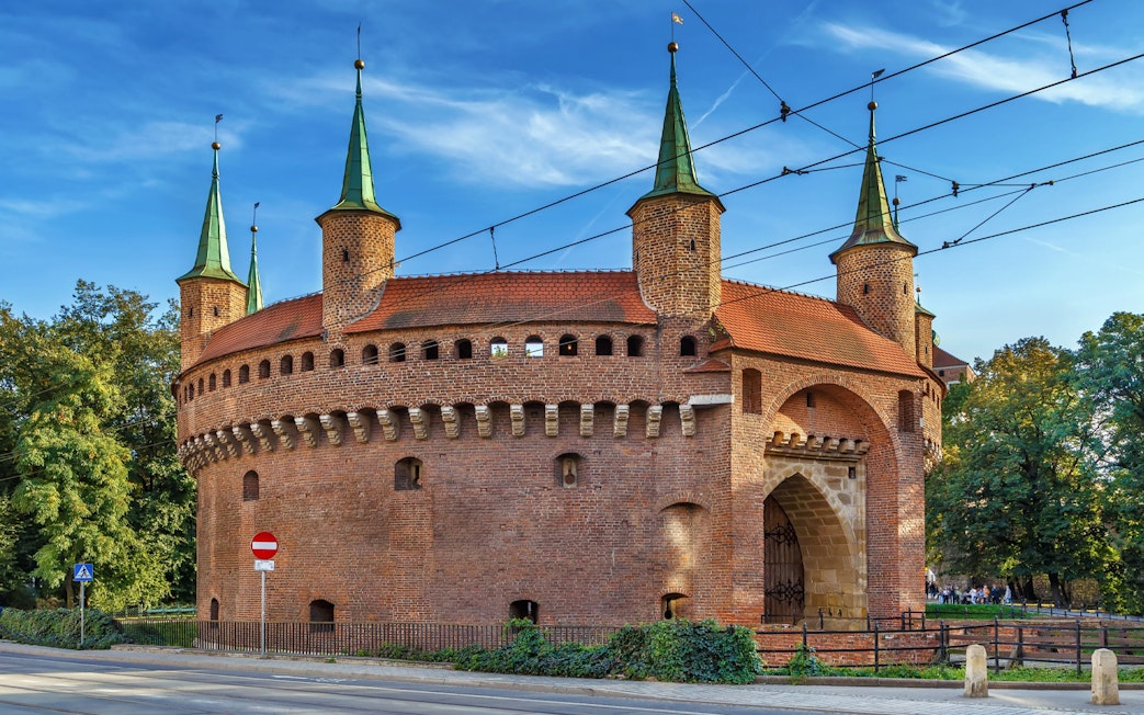Krakow Barbican with green spires on a guided city tour in an electric car.