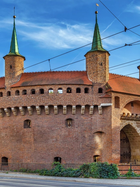 Krakow Barbican with green spires on a guided city tour in an electric car.