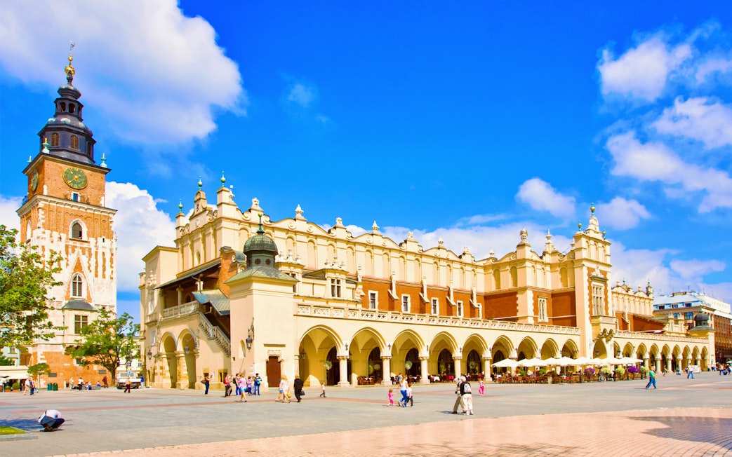 Krakow Cloth Hall and Town Hall Tower in Main Market Square during guided city tour.
