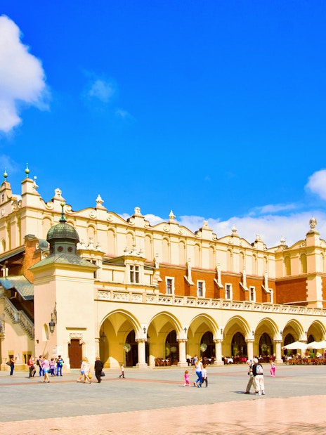 Krakow Cloth Hall and Town Hall Tower in Main Market Square during guided city tour.