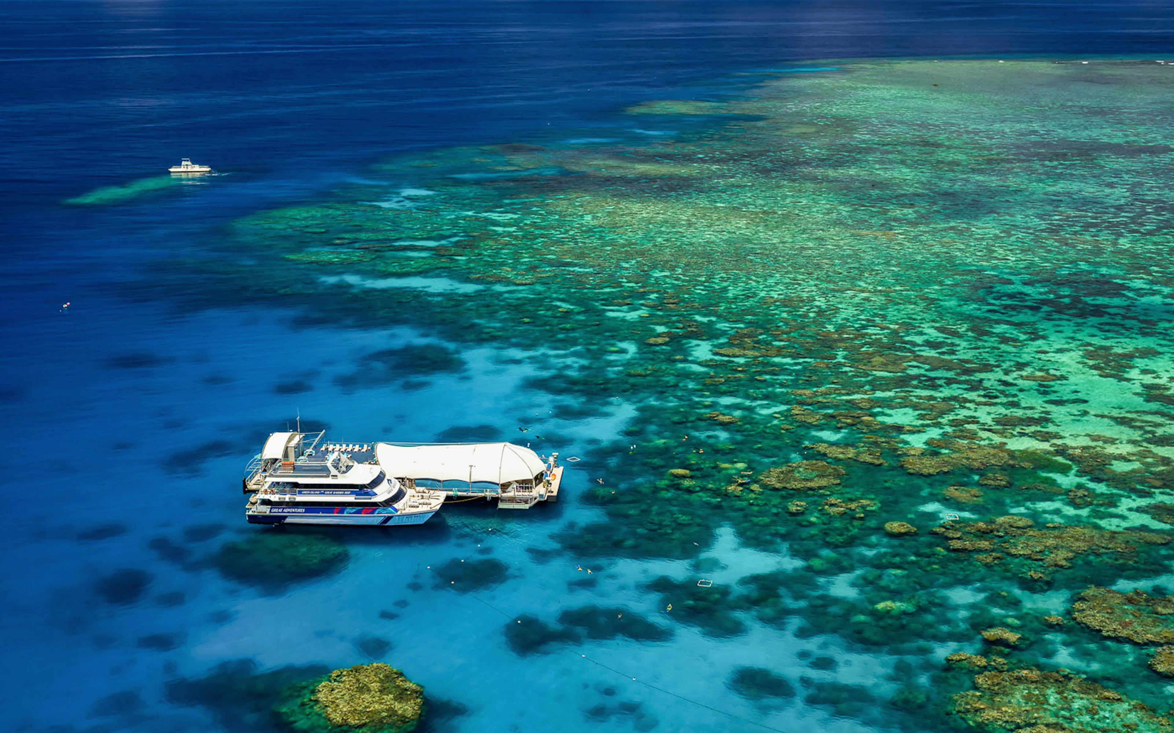 Cruise ship docked near coral reefs at Green Island, Great Barrier Reef.
