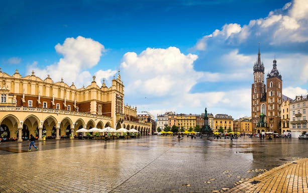 Krakow's Main Square with Cloth Hall and St. Mary's Basilica, ideal for a bike tour.