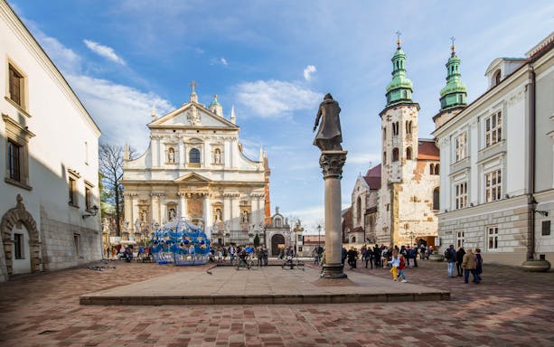 Bicycles parked near Saints Peter and Paul Church in Krakow during a bike tour.