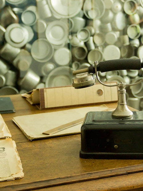 Old telephone and newspapers at Oskar Schindler's Factory exhibit in Krakow.