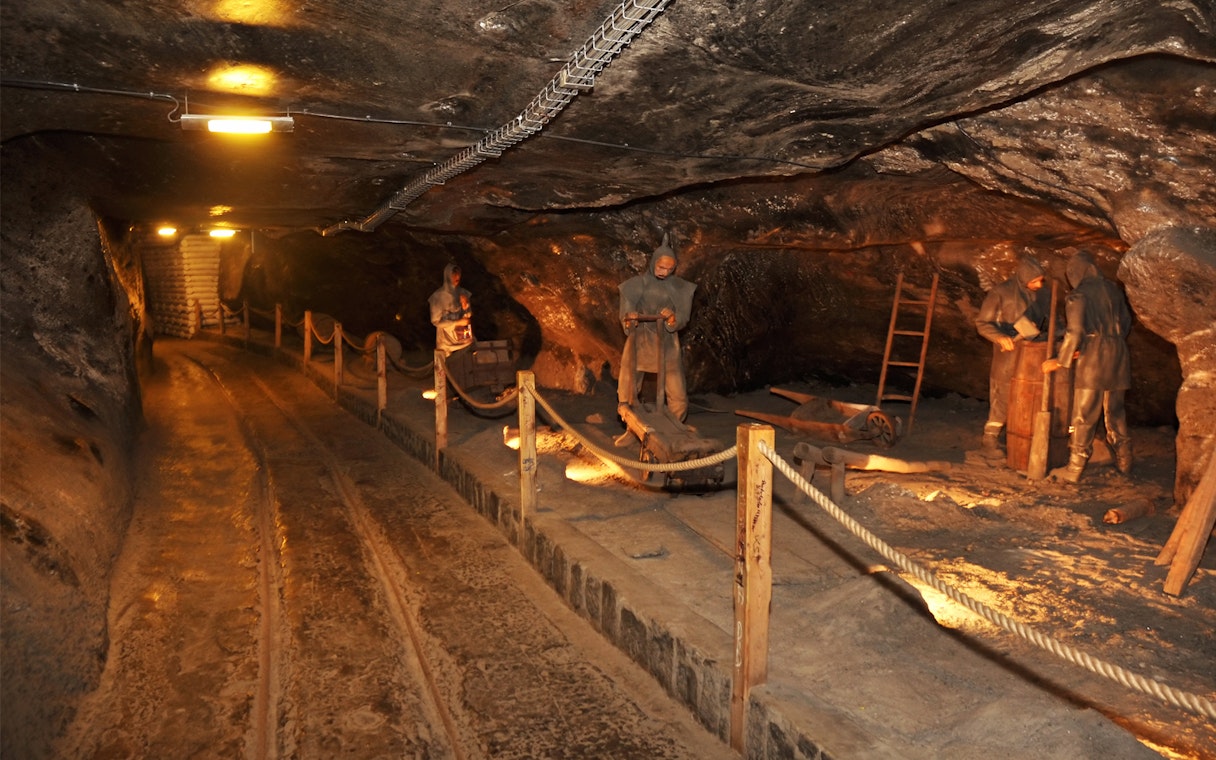 Miners' sculptures in Wieliczka Salt Mine tunnel, Krakow.