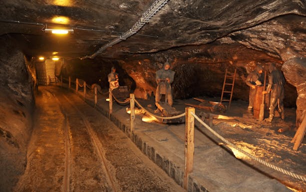 Miners' sculptures in Wieliczka Salt Mine tunnel, Krakow.