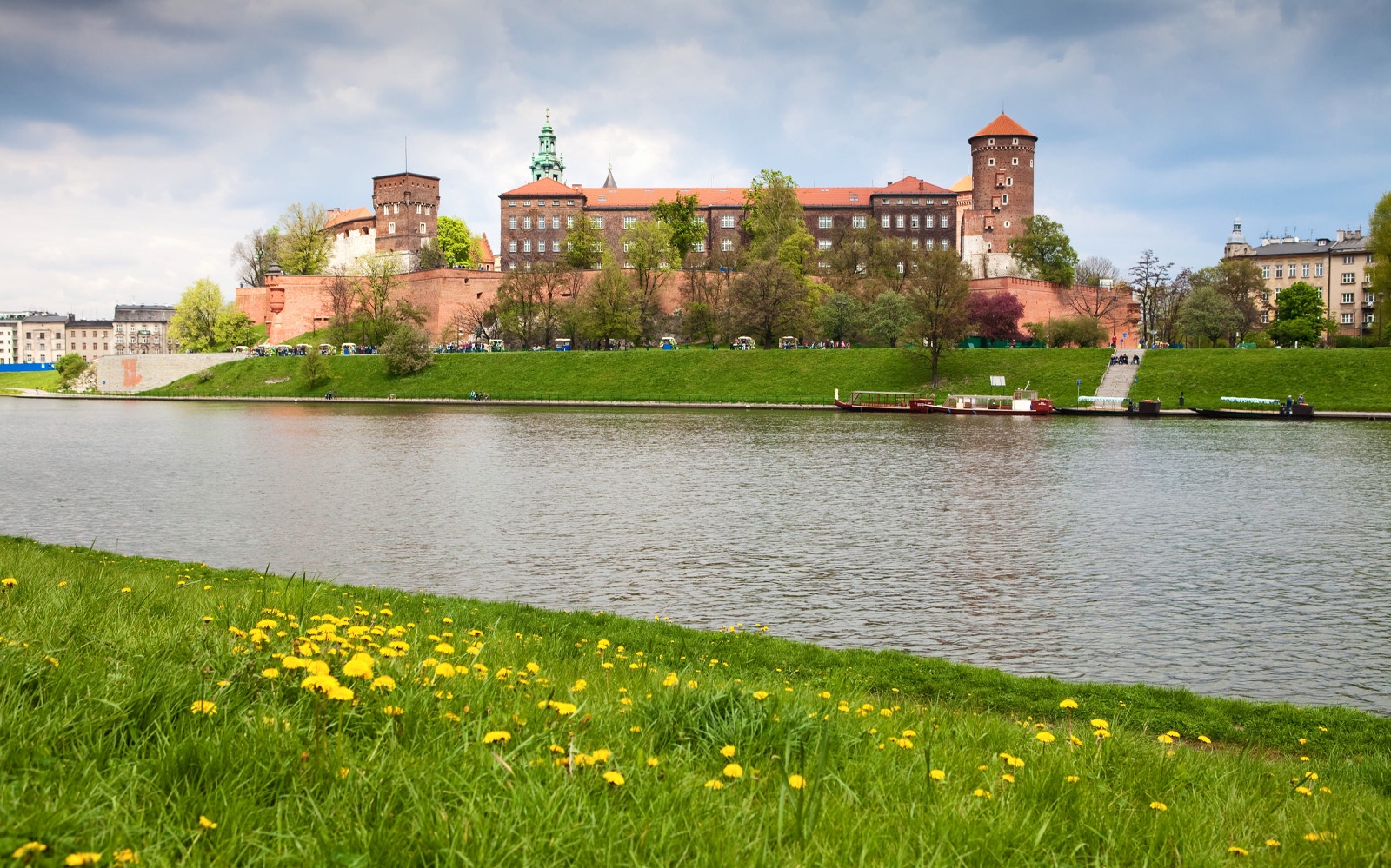 Wawel Castle and Cathedral exterior with guided tour group in Krakow, Poland.