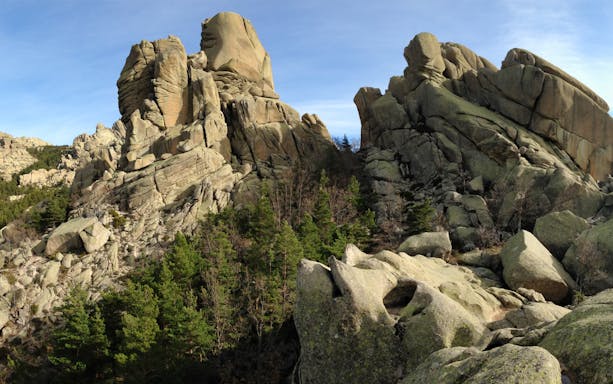 Rock formations and pine trees in Guadarrama National Park, Madrid.