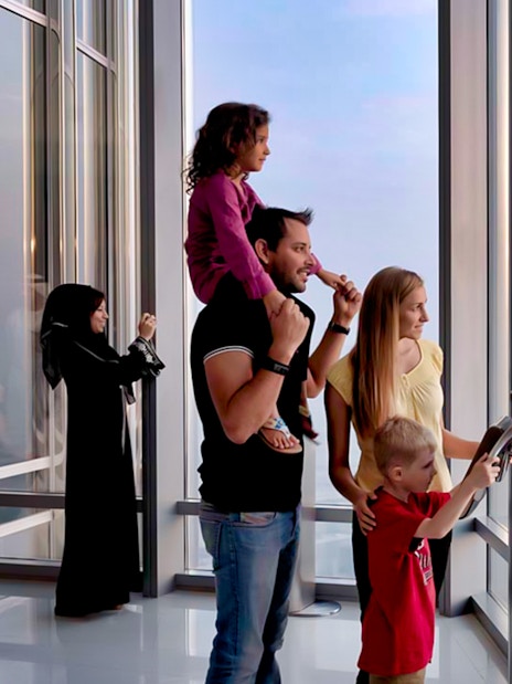 Visitors enjoying the view from Burj Khalifa's At The Top, Levels 124 and 125, Dubai.
