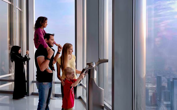 Visitors enjoying the view from Burj Khalifa's At The Top, Levels 124 and 125, Dubai.