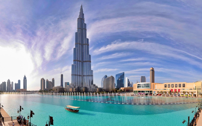 Burj Khalifa exterior with Dubai Fountain and surrounding skyline.