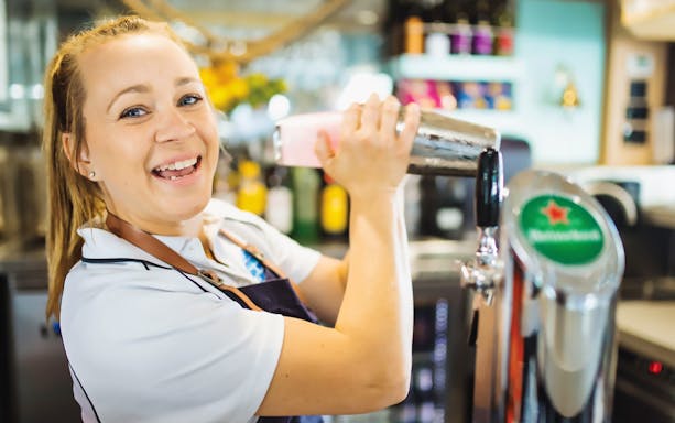 Bartender preparing a cocktail on Sea World Dinner Cruise with Live Entertainment.