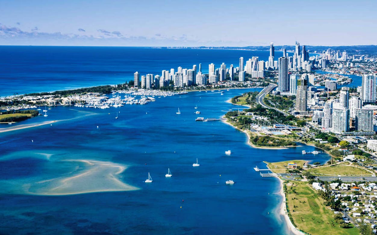 Gold Coast skyline with boats on the water, view from Hopo Hop On Hop Off Ferry.
