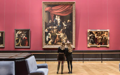 Visitors admiring paintings inside Kunsthistorisches Museum, Vienna.