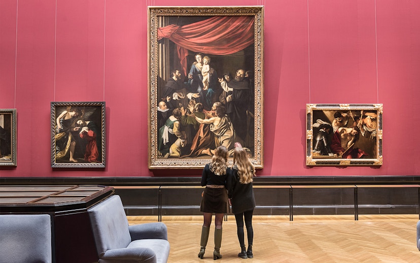 Visitors admiring paintings inside Kunsthistorisches Museum, Vienna.