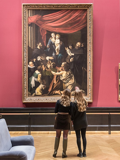 Visitors admiring paintings inside Kunsthistorisches Museum, Vienna.