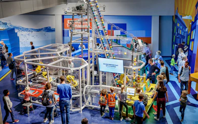 Visitors engaging with interactive exhibits at NEMO Science Museum, Amsterdam.