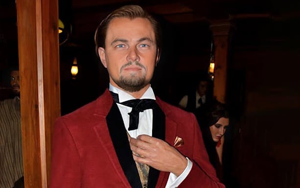 Wax figure of Leonardo DiCaprio in a red suit at the wax museum in Madrid.