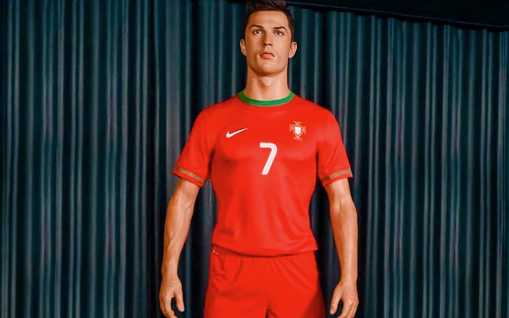 Wax figure of a soccer player in Portugal jersey at Wax Museum Madrid.
