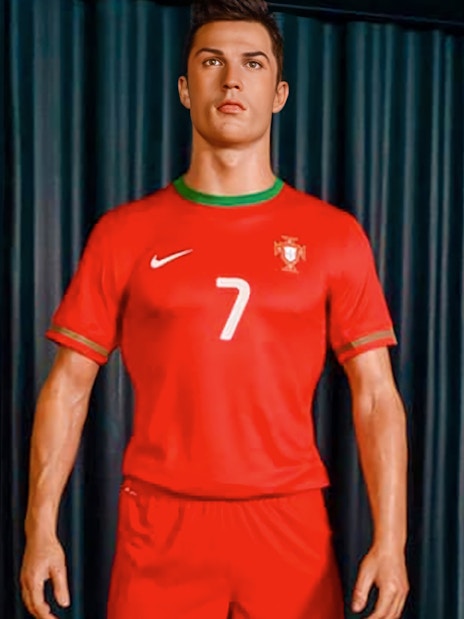 Wax figure of a soccer player in Portugal jersey at Wax Museum Madrid.