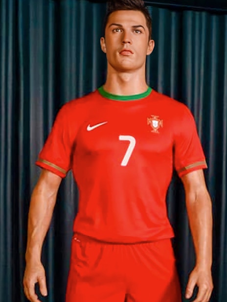 Wax figure of a soccer player in Portugal jersey at Wax Museum Madrid.