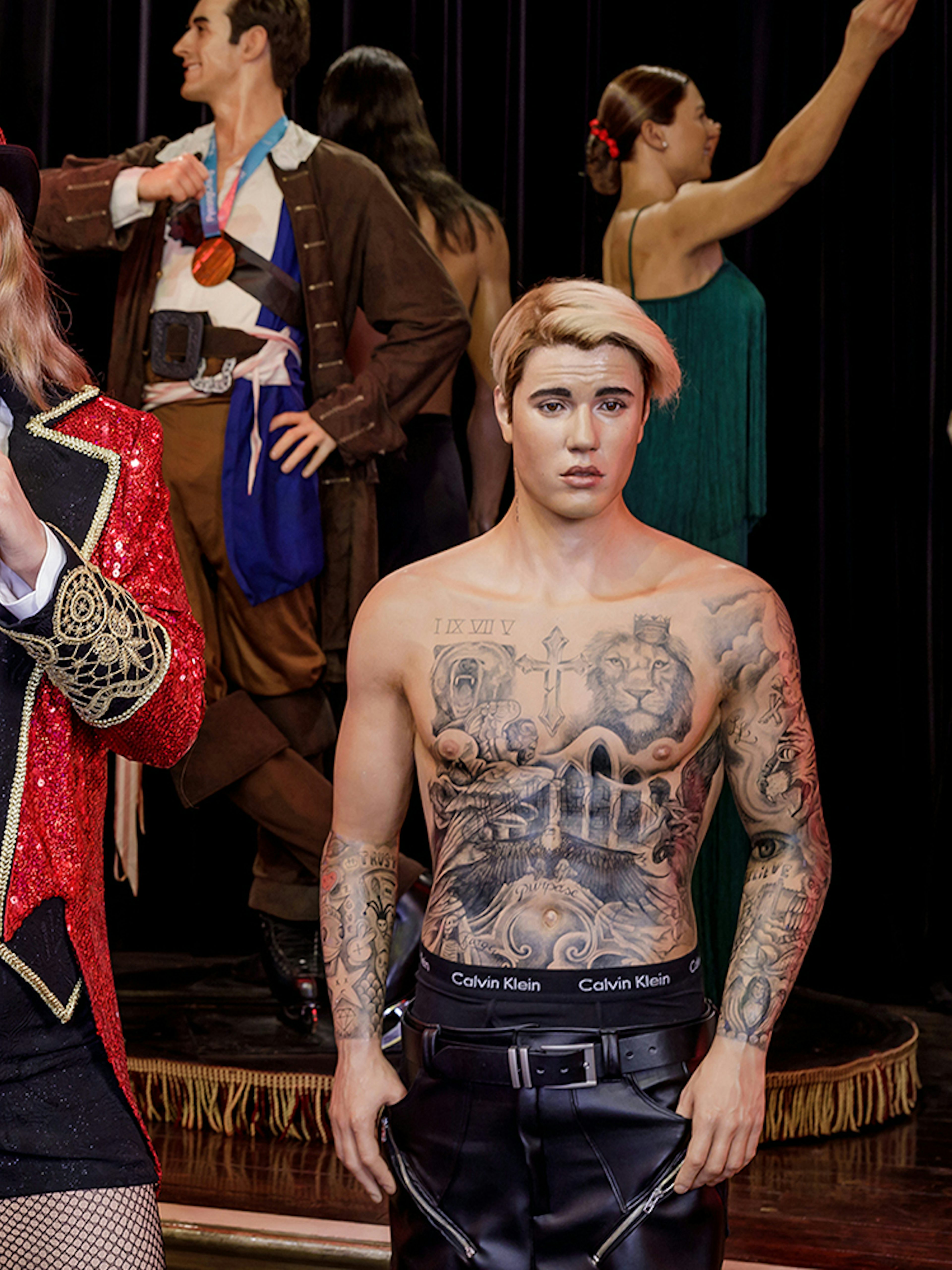 Wax figures of celebrities at Wax Museum Madrid exhibit.
