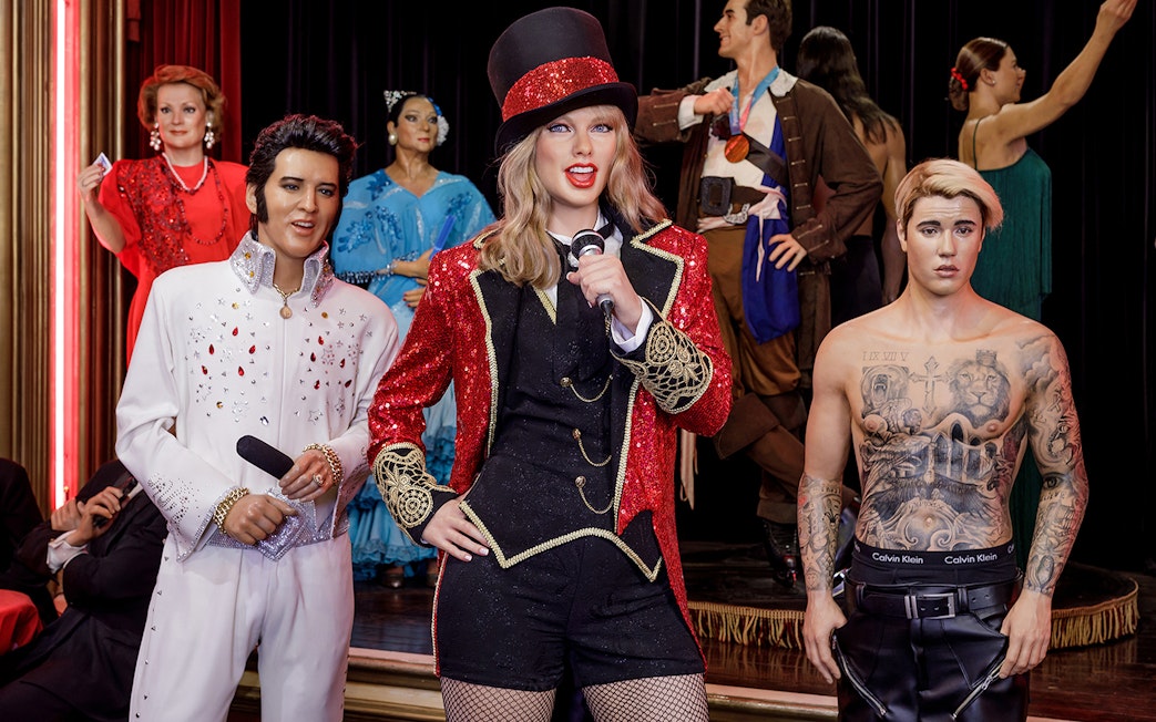 Wax figures of celebrities at Wax Museum Madrid exhibit.