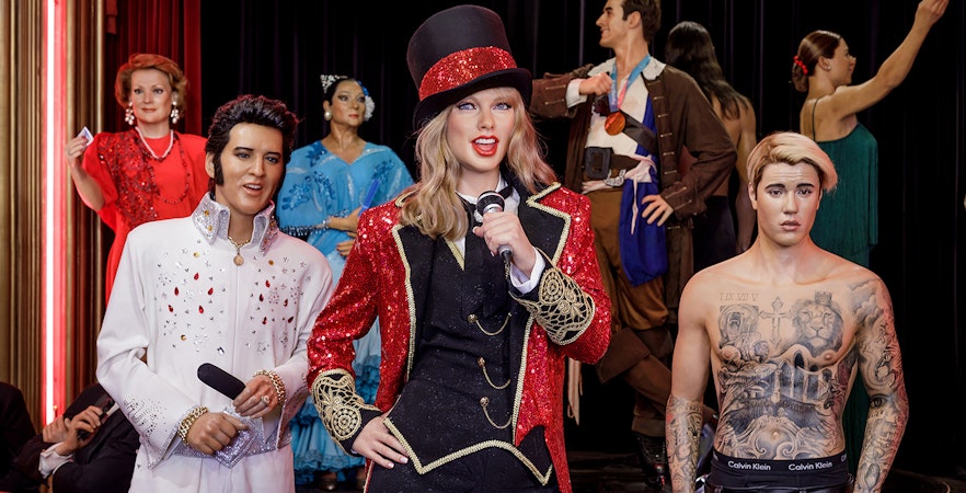 Wax figures of celebrities at Wax Museum Madrid exhibit.