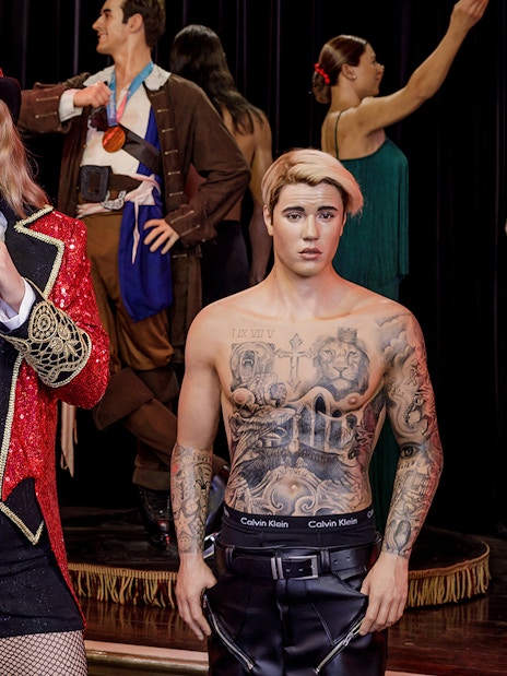 Wax figures of celebrities at Wax Museum Madrid exhibit.