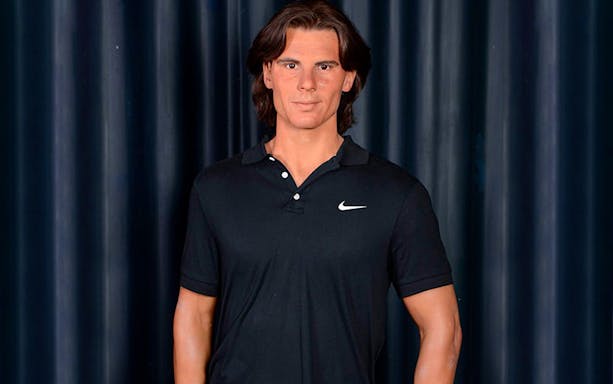 Wax figure of a man in a black shirt at Wax Museum Madrid.