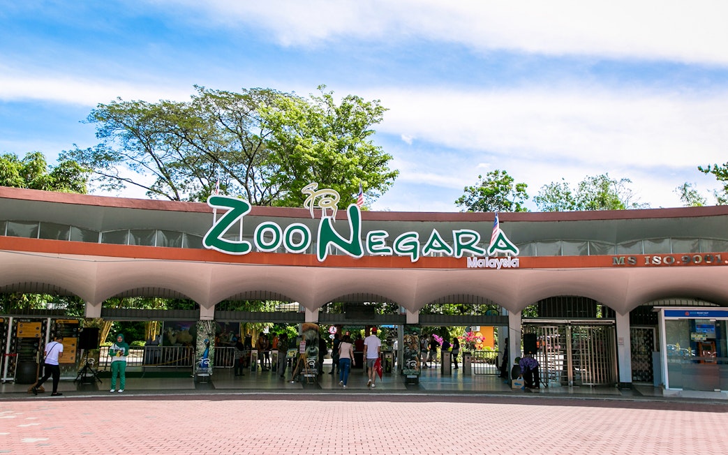 Zoo Negara entrance in Malaysia with visitors entering.