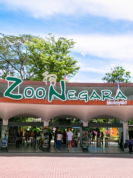 Zoo Negara entrance in Malaysia with visitors entering.