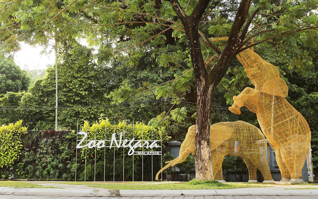 Zoo Negara entrance with elephant sculptures, Malaysia.