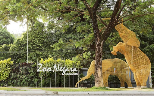Zoo Negara entrance with elephant sculptures, Malaysia.