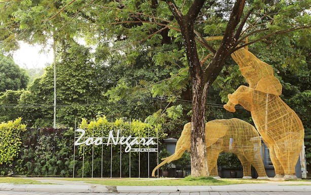 Zoo Negara entrance with elephant sculptures, Malaysia.