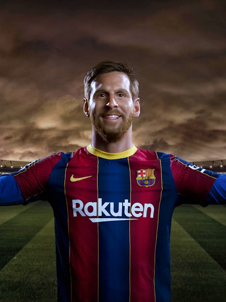 Wax figure of a soccer player in Barcelona jersey at Wax Museum Barcelona.