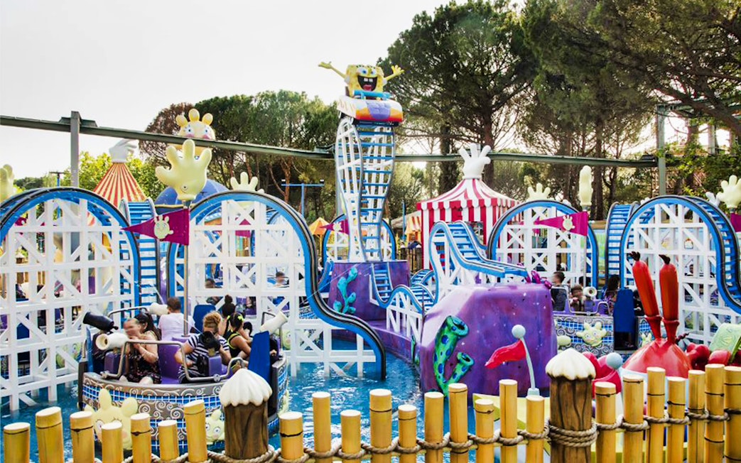 Roller coaster with cartoon theme at Parque de Atracciones de Madrid, skip-the-line access.
