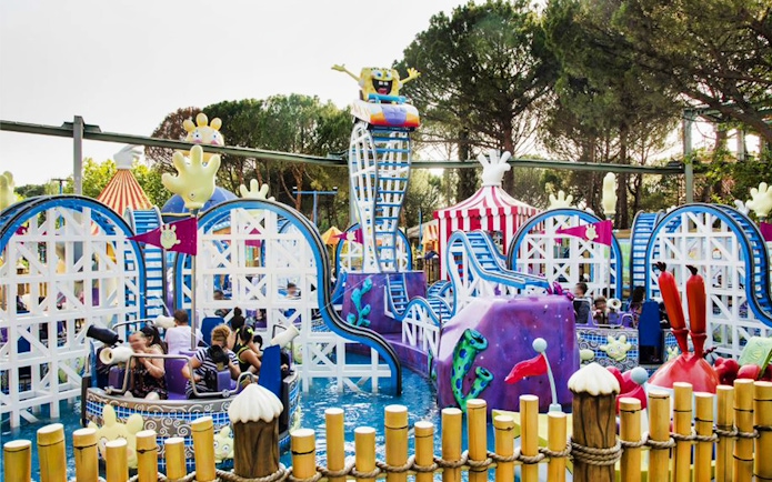 Roller coaster with cartoon theme at Parque de Atracciones de Madrid, skip-the-line access.