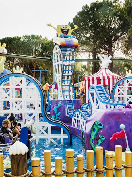 Roller coaster with cartoon theme at Parque de Atracciones de Madrid, skip-the-line access.