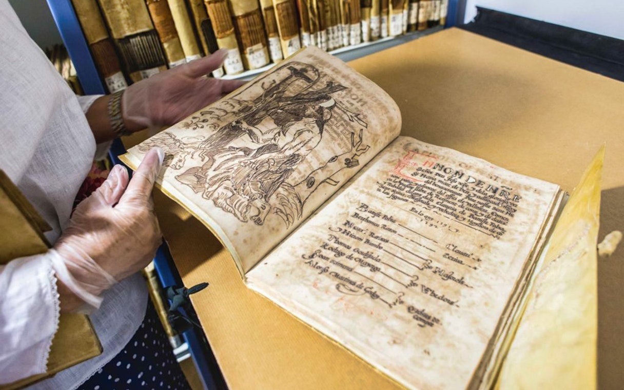 Old manuscript being examined at Silk Museum Valencia.