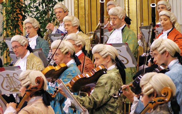 Orchestra in period costumes performing at Wiener Musikverein.