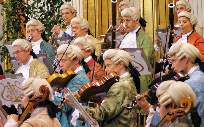 Orchestra in period costumes performing at Wiener Musikverein.