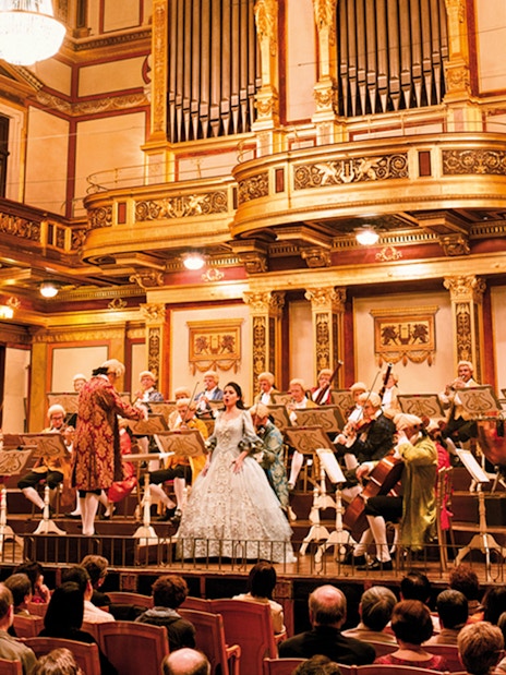 Orchestra performing at Wiener Musikverein concert hall in Vienna.