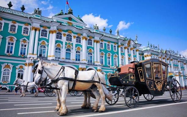 Horse-drawn carriage in front of the Hermitage Museum, St. Petersburg, during city tour.