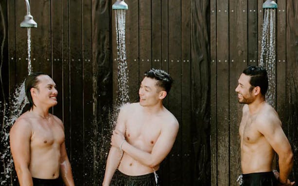 Men enjoying outdoor showers at Mornington Peninsula Hot Springs Bath House.