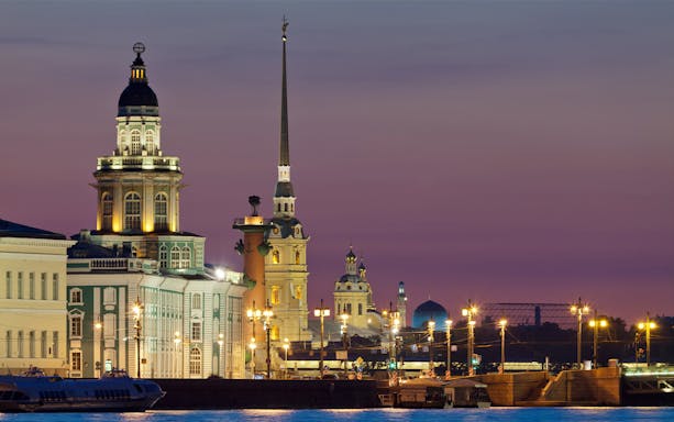 Evening view of illuminated buildings along Nevsky Prospekt, Saint Petersburg.