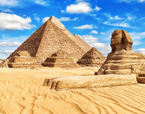 Pyramids of Giza with tourists using skip-the-line tickets in Cairo, Egypt.